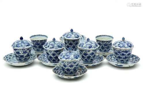 A part set of blue and white lidded cups and sauce…