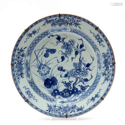 A blue and white rocks and floral charger 18th. Ce…