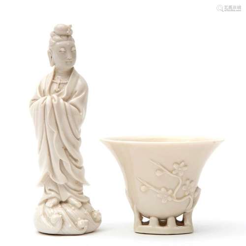 A blanc de Chine libation cup and a statue of Guan…