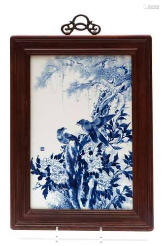 A Chinese porcelain plaque, blue and white, birds …