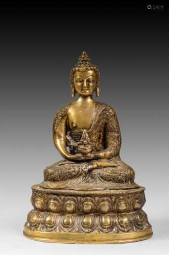 Bouddha assis sur un socle lotiforme tenant un bol…