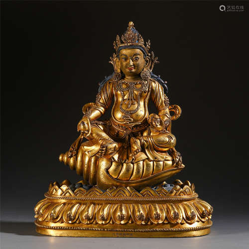 TIBETAN GILT BRONZE SEATED BUDDHA ON SNAIL STAND