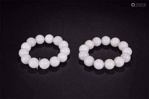 A Pair of Chinese Carved Jade Beads Bracelets