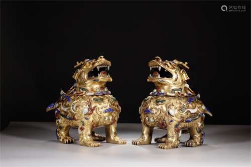 A Pair of Chinese Gilt Bronze Candle Holders