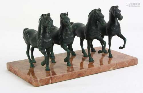 Archaistic style patinated figural horses, mounted on a