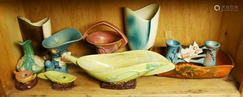 One shelf of Roseville pottery