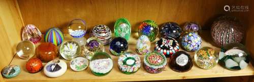 One shelf of paperweights