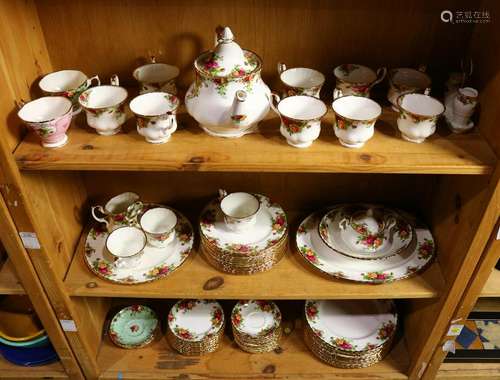 Three shelves of Royal Albert table service in the 