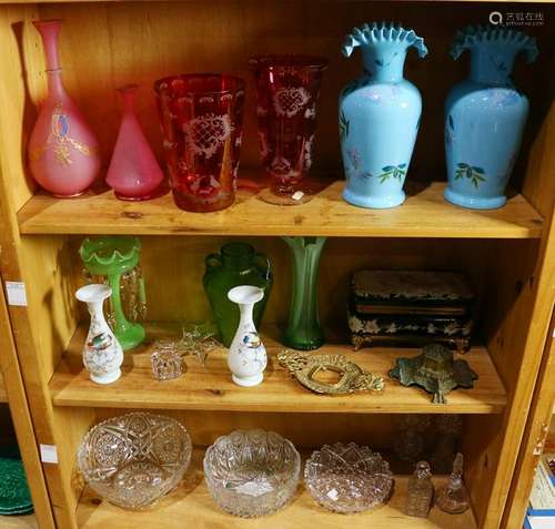 Three shelves of decorative art