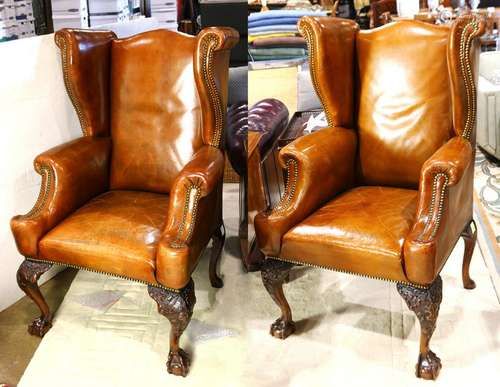 Pair of Georgian style leather wing back arm chairs