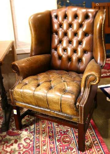 Victorian style leather upholstered wing armchair