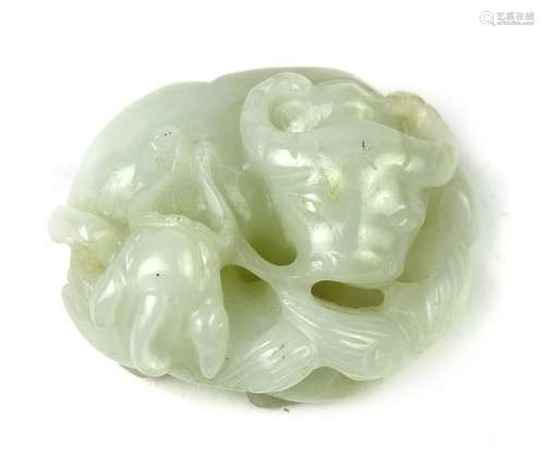 A Chinese pale jade carving of a recumbent ox and