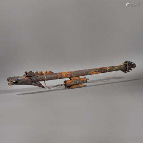 Traditional blowgun made from exotic wood, with a …
