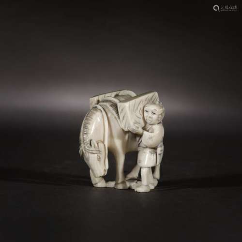 Ivory netsuke of a carrier and his horse, signatur…