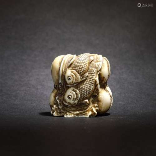 Ivory netsuke of a fisherman's haul, signature: Gy…