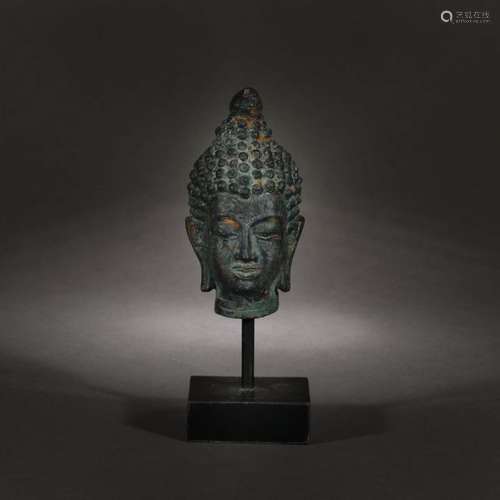 Fragment of a statuette representing a Buddha head…