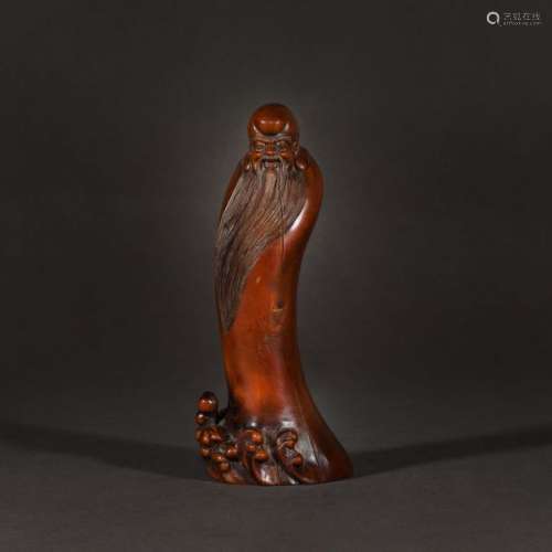 Exotic wood carving of Shou Lao, god of longevity,…