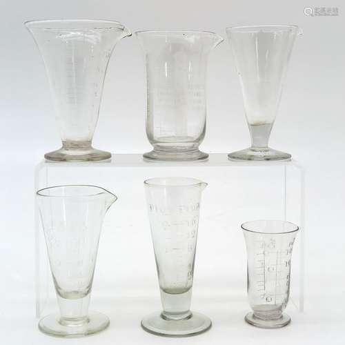 A Collection of Antique Glass Measuring Cups