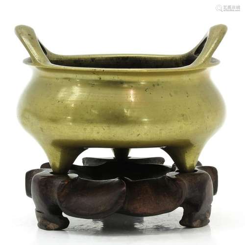 A Chinese Bronze Tripod Censer