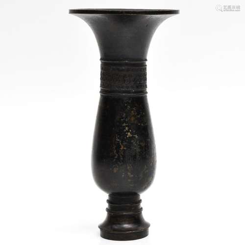 A Chinese Bronze Candlestick