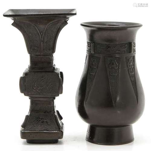 A Chinese Bronze Candlestick and Vase