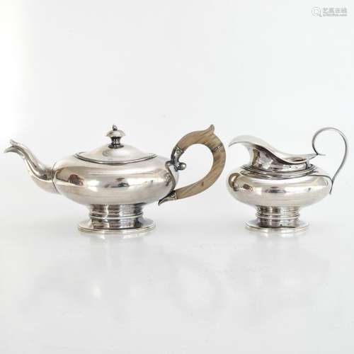 A Silver Teapot and Creamer