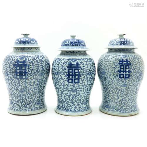 Three Blue and White Jars with Covers