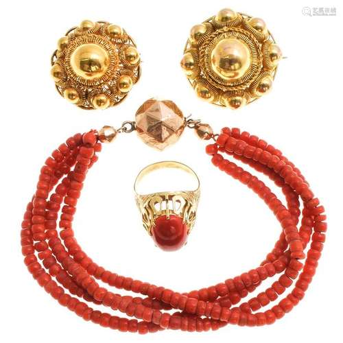 A Diverse Collection of Jewelry Including Red Cora…