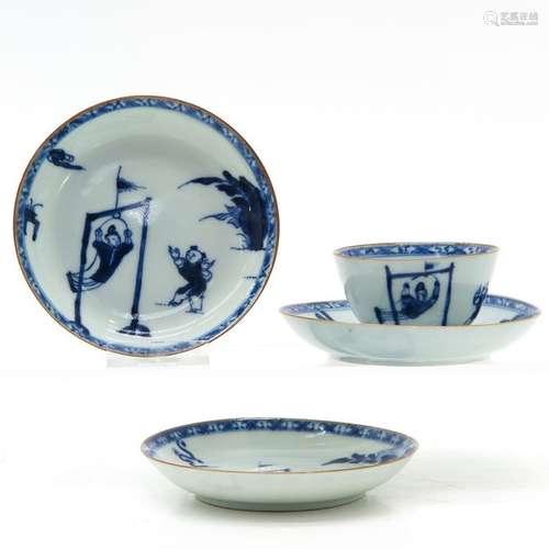 A Chinese Blue and White Cup and Saucers