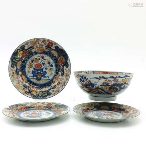 An Imari Serving Bowl and Three Plates