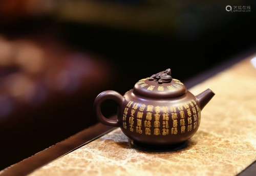 A CHINESE PURPLE CLAY TEAPOT OF 紫砂壶“百福壶”