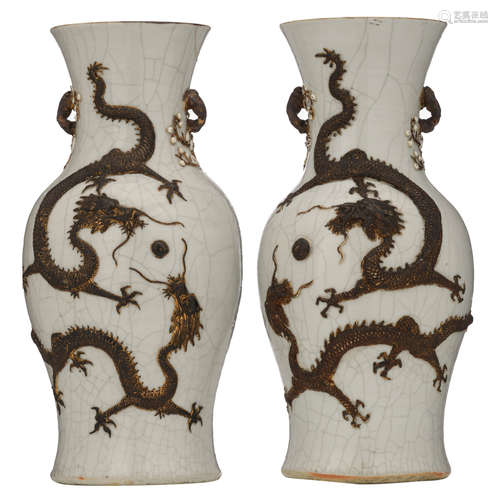 A pair of Chinese relief decorated crackleware vases, with dragons, chasing the flaming pearl, marked, H 44 cm     