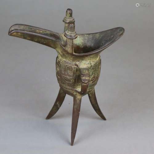 A Chinese Shang-style ritual bronze tripod vessel …