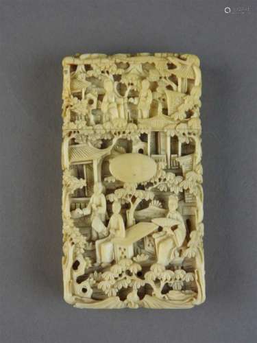 A Chinese Canton ivory card case, Qing Dynasty, of rectangular form, carved with figures on terraces