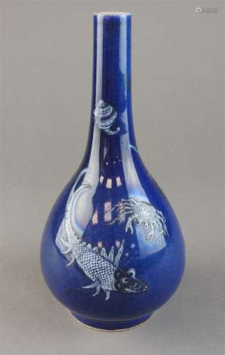 A Chinese powder blue ground slip decorated bottle vase, Qing Dynasty, 19 th century, the body