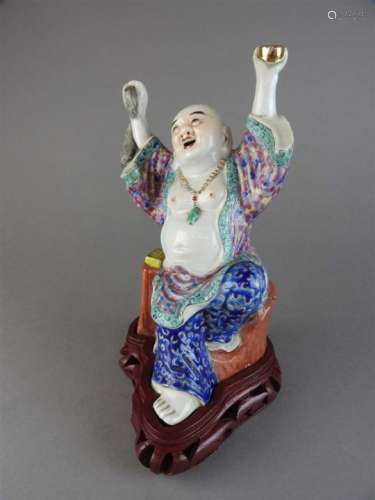 A Chinese famille rose porcelain figure of Hotei, early 20th century.