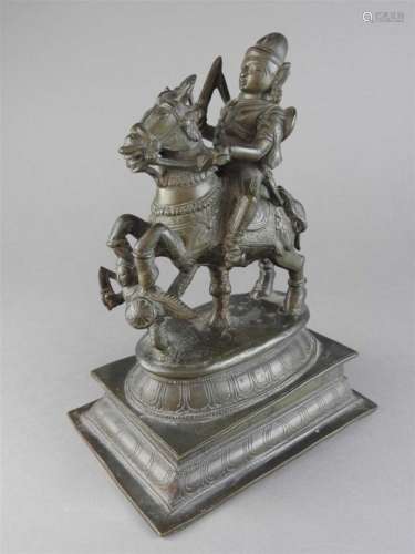 An Indian bronze figure of a warrior deity on a rearing horse with attendant, 19 th century, on an