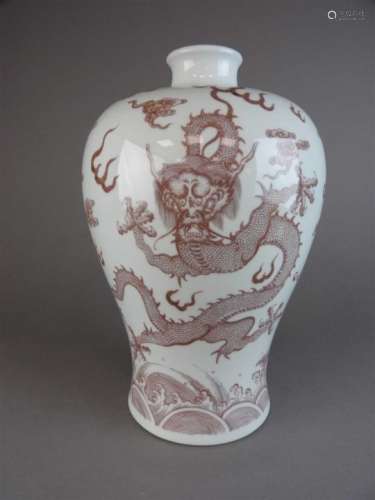 A large Chinese porcelain iron red baluster vase (meiping), the body decorated with two opposing
