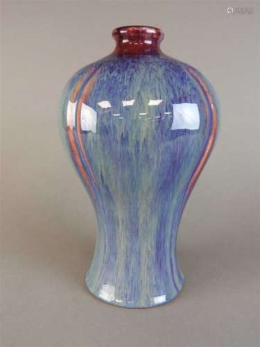 A Chinese flambe baluster vase, Qing Dynasty, 19 th century, of lobed outline, covered in an all