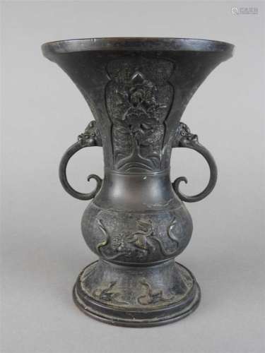 A bronze 'gu' vase, 19th century, of archaistic form, cast with shaped panels of flowers against a