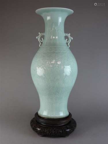 A large Chinese celadon baluster vase, Qing dynasty, early 19th century, the flaring neck above a