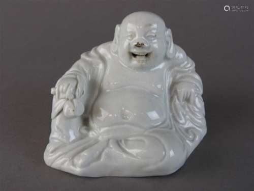 A Chinese blanc de chine figure of Budai, 19th century, the laughing fellow with open mouth