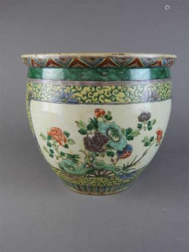 A Chinese famille verte porcelain planter, Qing Dynasty, 19 th century, of swelling round form,