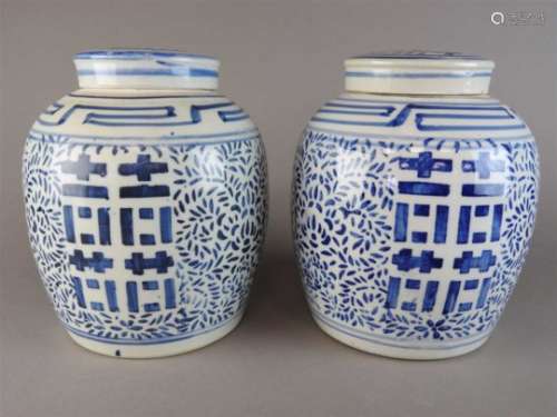 A pair of Chinese blue and white jars and covers, 20 th century, each of ovoid form and decorated