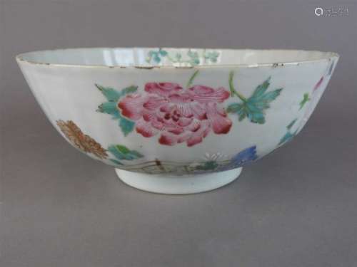A Chinese export porcelain famille rose fluted bowl, Qianlong, the interior decorated with peony and