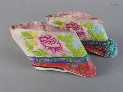 A pair of Chinese silk embroidered slippers for bound feet, early 20 th century, decorated with