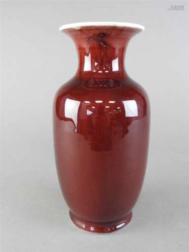 A Chinese sang de boeuf vase, Qing Dynasty, 19 th century, the deep blood red body with a lighter