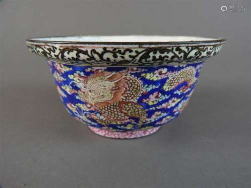 A Canton enamel dragon bowl, Qing Dynasty, with dished everted rim, the interior with two peaches on