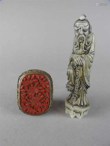 A Chinese cinnabar lacquer buckle, Qing Dynasty, 19 th century, of rounded rectangular form