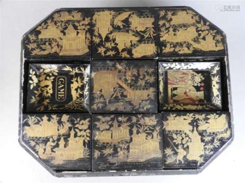 A Chinese export lacquer games box and cover, Qing dynasty, circa 1840, of canted rectangular form